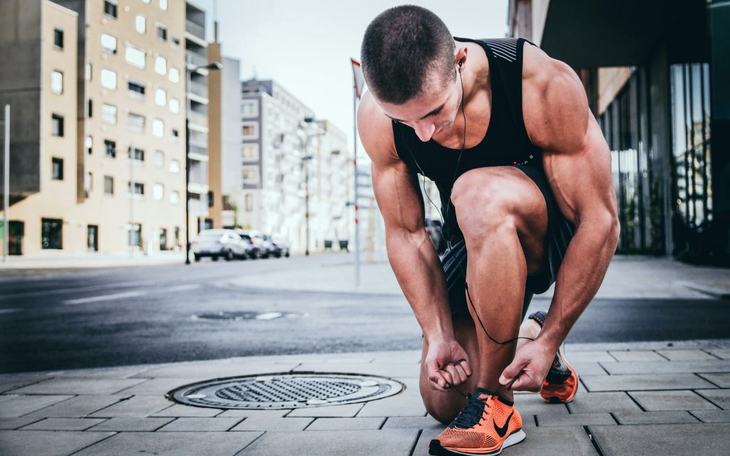 Runner at sunrise in warm morning light